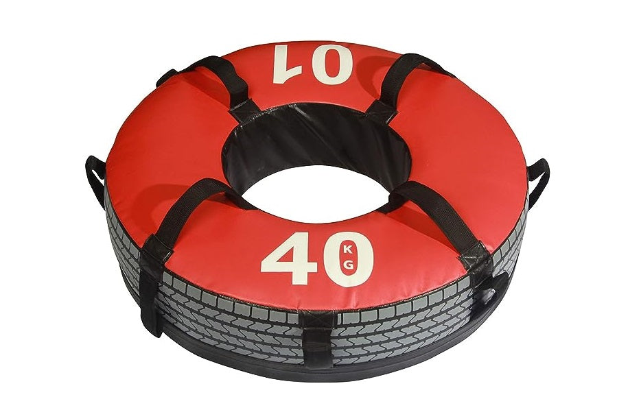 Red and black 40kg workout tire with rope handles on white background