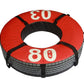 Red and black 80kg weighted tire with handles, viewed from above on white background
