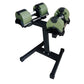 Pair of sage green and black adjustable dumbbells on black stand, showing weight adjustment mechanism and metal handles