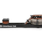WaterRower Club rowing machine with black base, wood accents, and water resistance tank, side view on white background