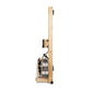 WaterRower Oak rowing machine with natural wood frame, water resistance tank, and black metal hardware on white background