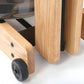 Light oak wood rowing machine with black casters and metal hardware, shown at angle on white background
