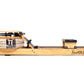 Xeno Muller Signature Edition wooden rowing machine with clear water tank, black hardware, and wheels on white background