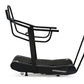Black Woodway Curve FTG treadmill with curved running belt, dual handles, and footrest on white background