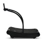 Black curved treadmill with motorless belt, arched running surface, and upright display arm on white background