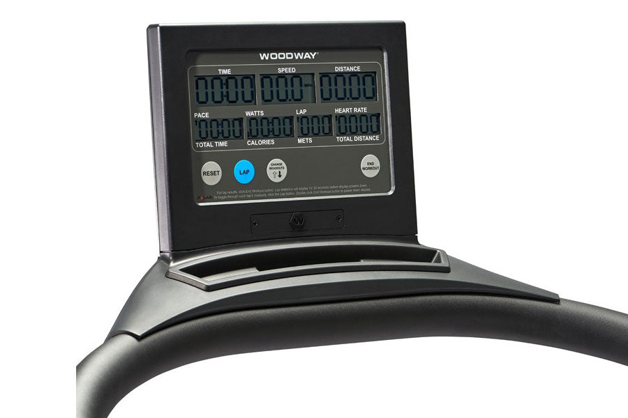 Woodway Curve Treadmill with black console displaying time, speed, distance, watts, lap, heart rate, pace, calories, meters, 
