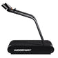 Black Woodway treadmill running deck with attached power cord and connector on white background